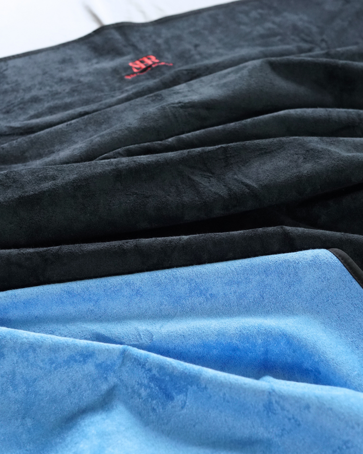 Close-up of black and blue bamboo and cotton blanket fabric