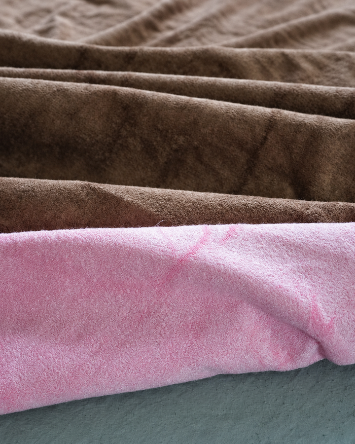 Close-up of the soft Coffee and Pink bamboo and cotton blanket fabric
