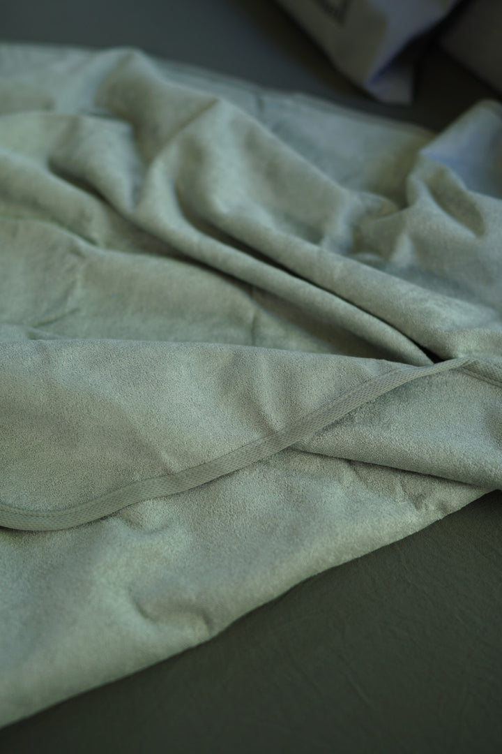 Close-up of Crystal bamboo and cotton fabric and stitched edging